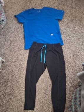 Carhartt Blue Scrub Top with Black Jogger Style Bottoms